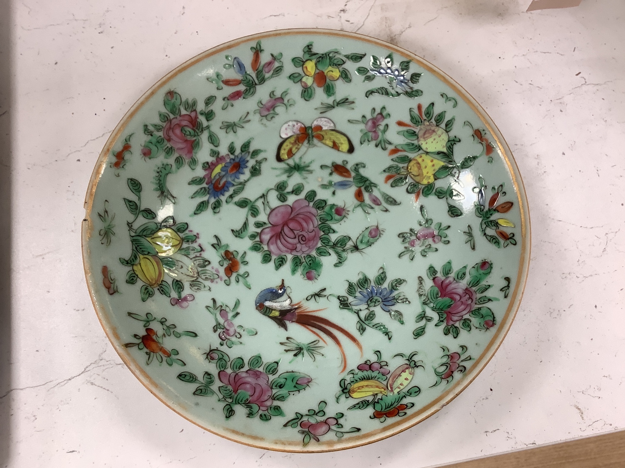 A Chinese famille rose plate and a celadon plate, diameter 24cm